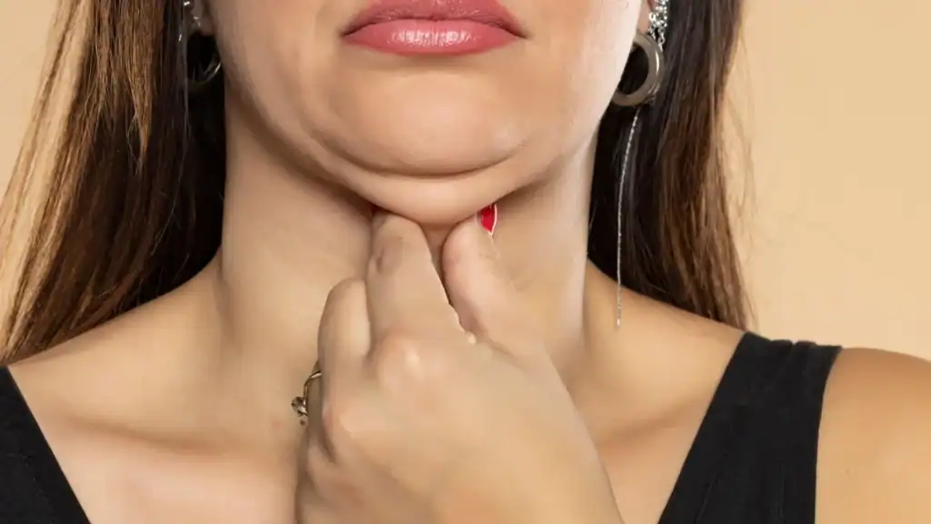 An image of a woman with double chin, sad, worried : Non Surgical Double Chin Removal Treatment in Frimley, UK